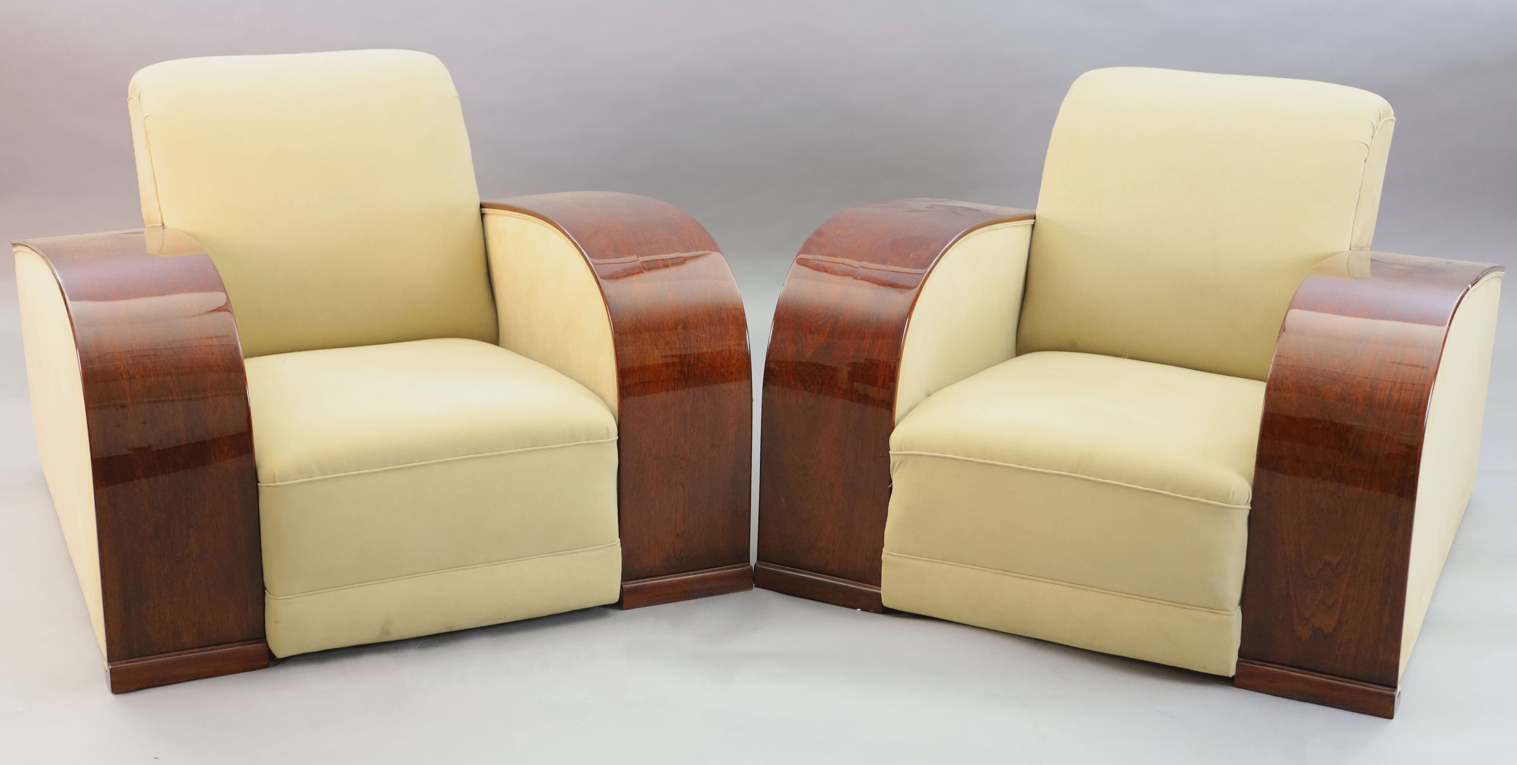 An Art Deco style mahogany and suede three piece suite, settee W.6ft 6in. D.3ft 4in. H.2ft 6in.